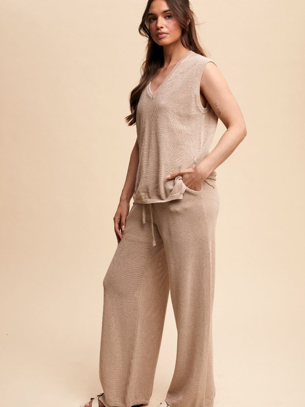 2 Piece knit sleeveless top with matching pants.  Shorts built into pants.